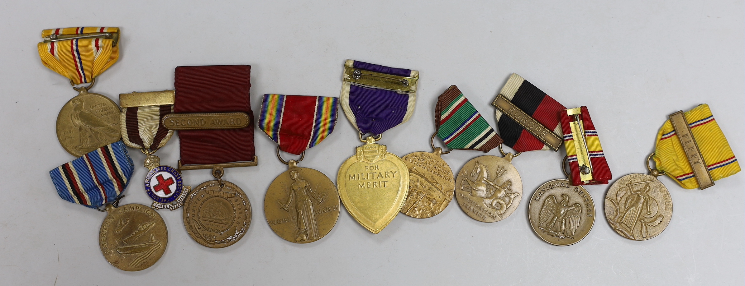 A collection of American WWII medals, including a Purple Heart, unnamed